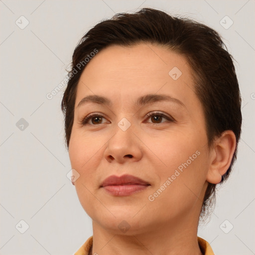 Joyful white adult female with short  brown hair and brown eyes