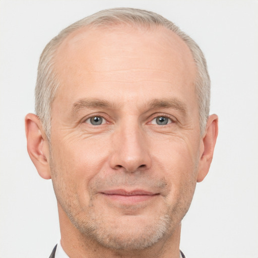 Joyful white adult male with short  brown hair and grey eyes