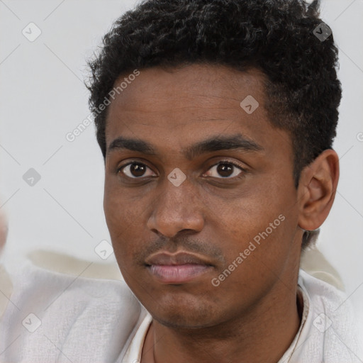 Neutral black young-adult male with short  black hair and brown eyes