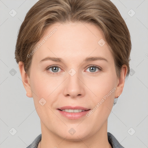 Joyful white young-adult female with short  brown hair and grey eyes