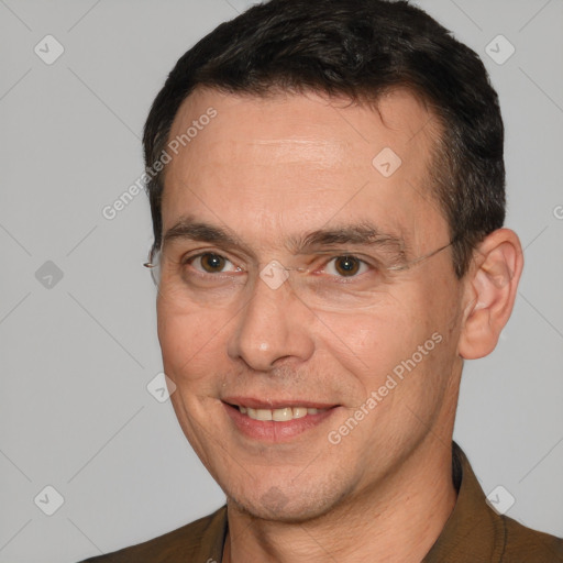 Joyful white adult male with short  brown hair and brown eyes