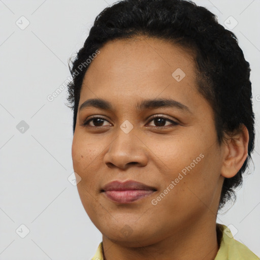 Joyful latino young-adult female with short  black hair and brown eyes