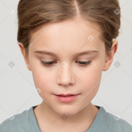 Joyful white child female with short  brown hair and brown eyes