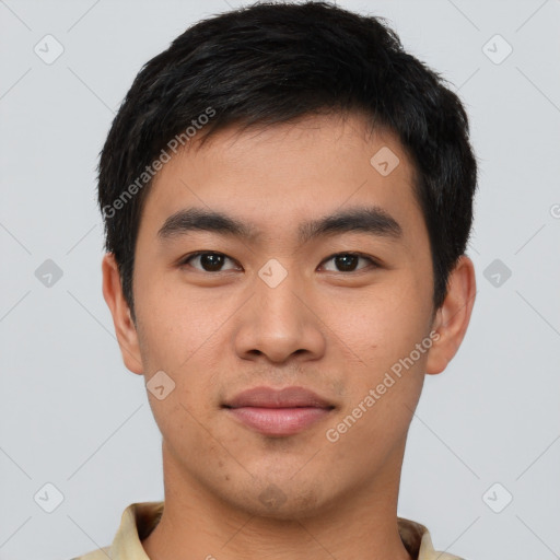 Joyful asian young-adult male with short  brown hair and brown eyes