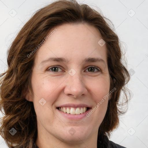 Joyful white young-adult female with long  brown hair and green eyes