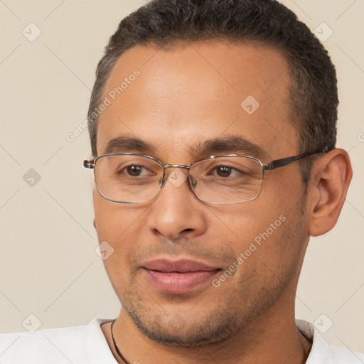 Joyful white adult male with short  brown hair and brown eyes