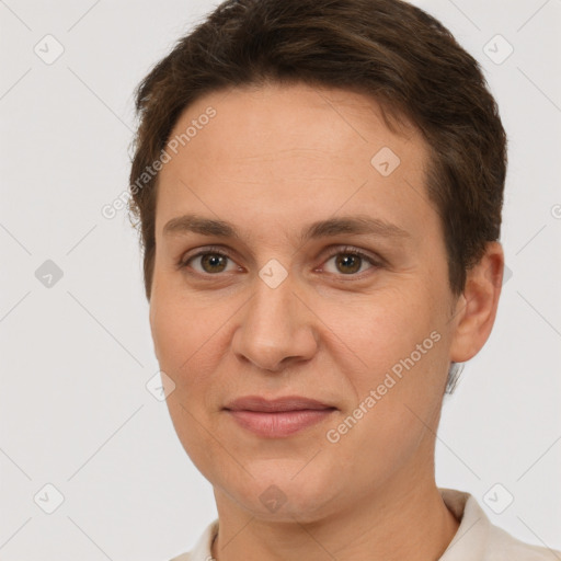 Joyful white adult female with short  brown hair and grey eyes