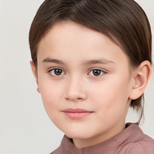 Joyful white child female with short  brown hair and brown eyes