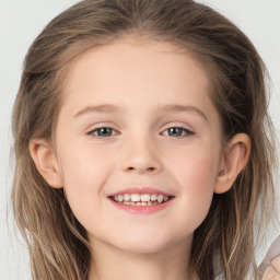 Joyful white child female with long  brown hair and brown eyes