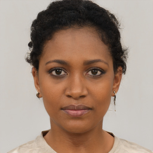 Neutral black young-adult female with short  black hair and brown eyes