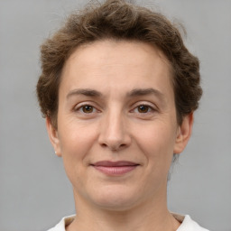 Joyful white adult female with short  brown hair and brown eyes