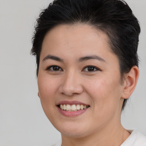 Joyful white young-adult female with short  brown hair and brown eyes
