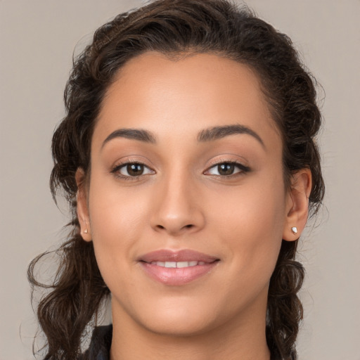 Joyful white young-adult female with long  brown hair and brown eyes