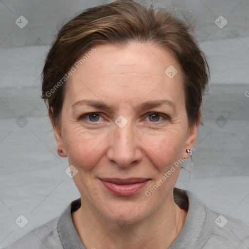 Joyful white adult female with medium  brown hair and grey eyes