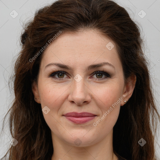 Joyful white adult female with long  brown hair and green eyes