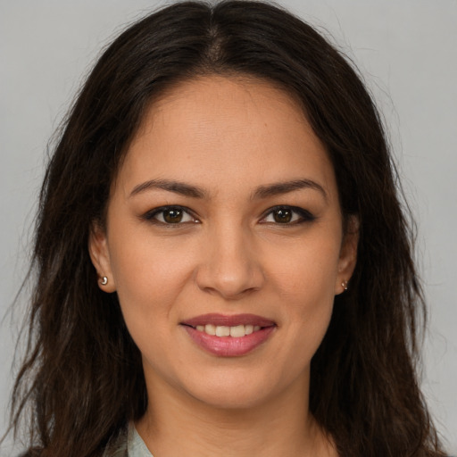 Joyful white young-adult female with long  brown hair and brown eyes