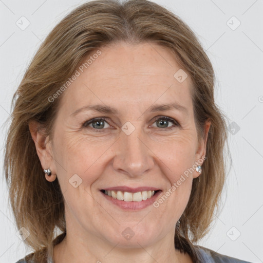 Joyful white adult female with medium  brown hair and grey eyes