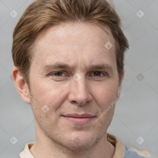 Joyful white adult male with short  brown hair and grey eyes