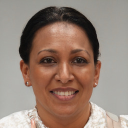 Joyful black adult female with short  brown hair and brown eyes