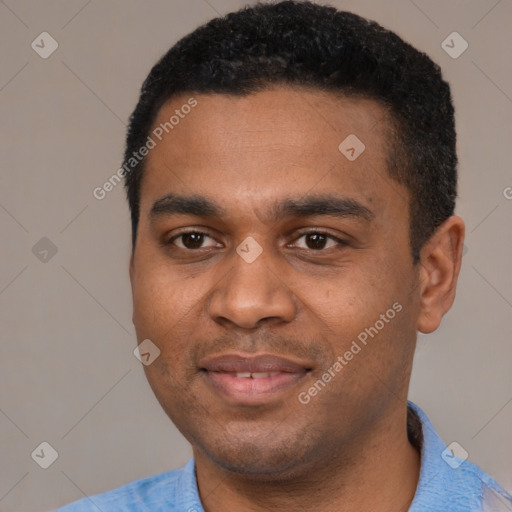 Joyful black young-adult male with short  black hair and brown eyes