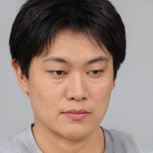 Neutral asian young-adult female with short  brown hair and brown eyes