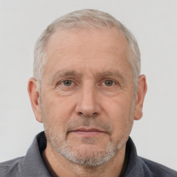 Neutral white middle-aged male with short  gray hair and brown eyes