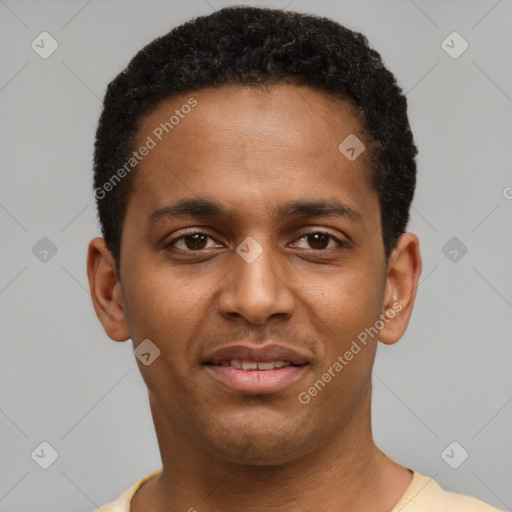 Joyful black young-adult male with short  brown hair and brown eyes