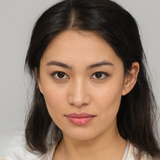 Joyful asian young-adult female with medium  brown hair and brown eyes