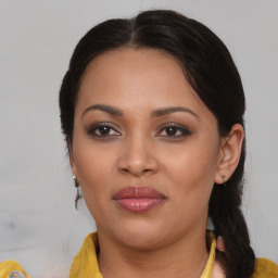 Joyful black young-adult female with medium  brown hair and brown eyes