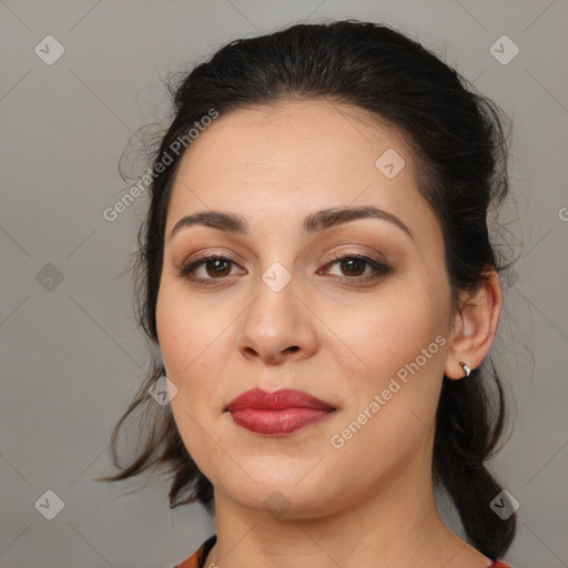 Joyful white adult female with medium  brown hair and brown eyes