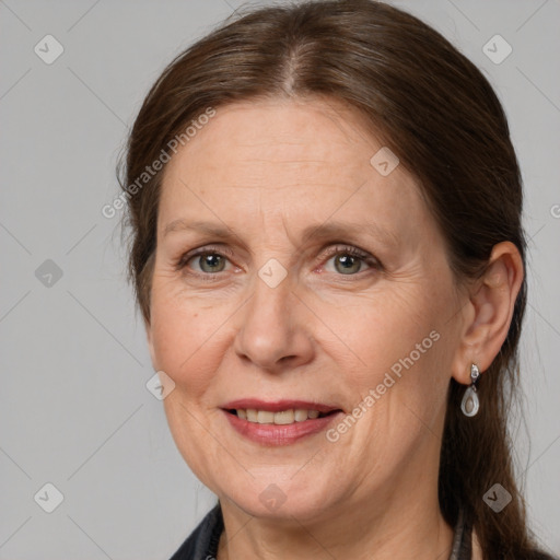 Joyful white adult female with medium  brown hair and grey eyes