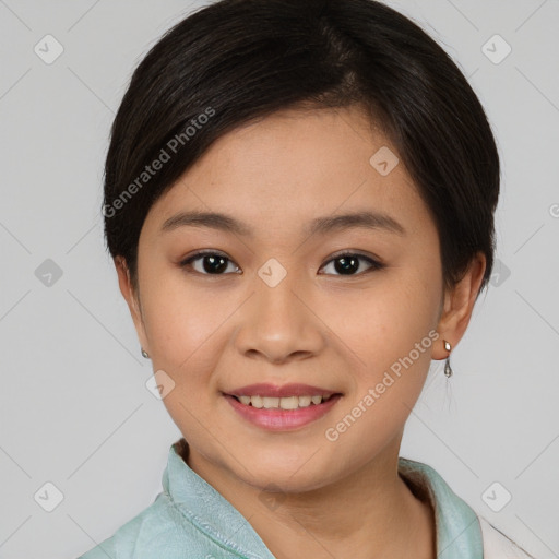 Joyful asian young-adult female with short  brown hair and brown eyes