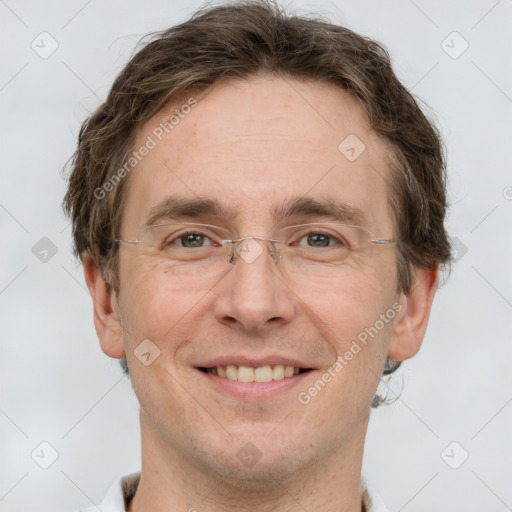 Joyful white adult male with short  brown hair and grey eyes