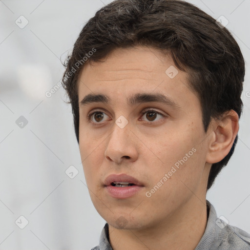 Neutral white young-adult male with short  brown hair and brown eyes