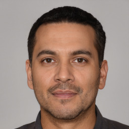 Neutral white adult male with short  black hair and brown eyes