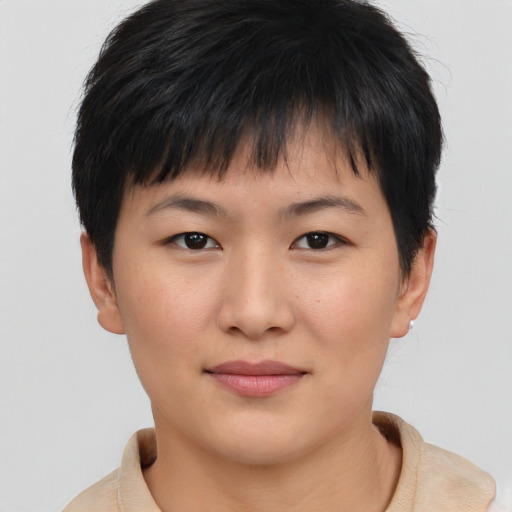 Joyful asian young-adult female with short  brown hair and brown eyes