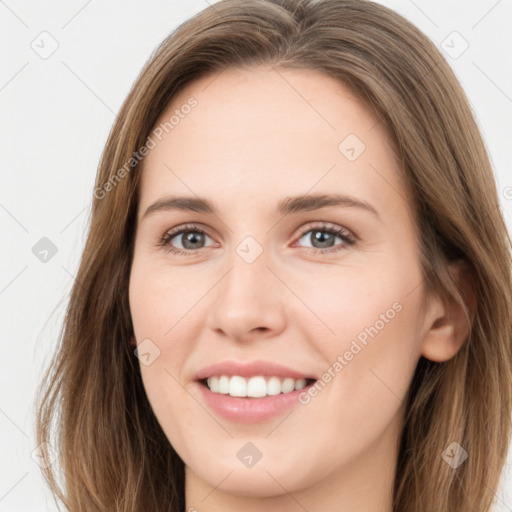 Joyful white young-adult female with long  brown hair and green eyes