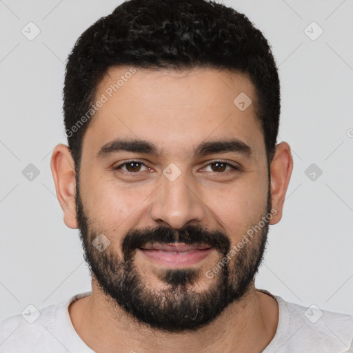 Joyful latino young-adult male with short  black hair and brown eyes