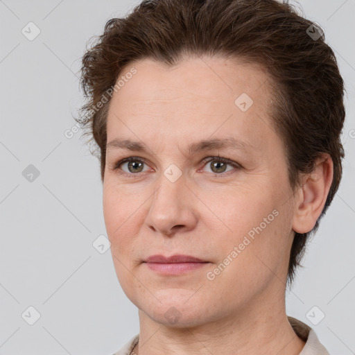 Joyful white adult female with short  brown hair and brown eyes