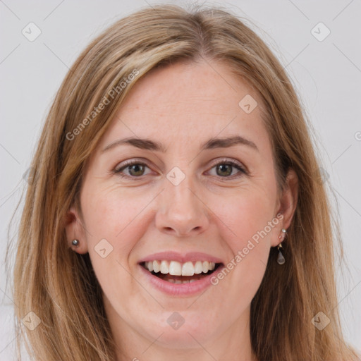 Joyful white young-adult female with long  brown hair and grey eyes