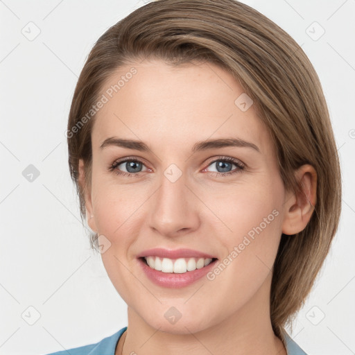 Joyful white young-adult female with medium  brown hair and grey eyes