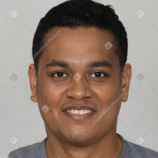 Joyful latino young-adult male with short  black hair and brown eyes
