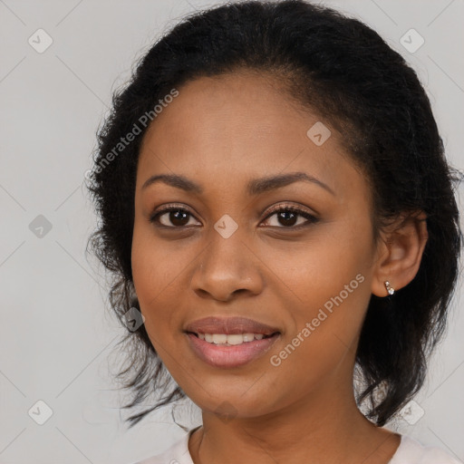 Joyful black young-adult female with medium  brown hair and brown eyes