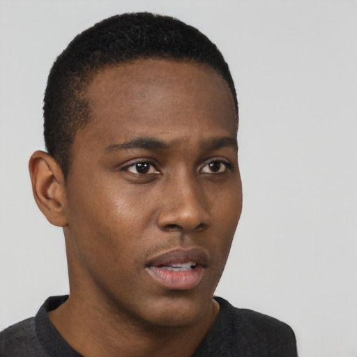 Neutral black young-adult male with short  black hair and brown eyes