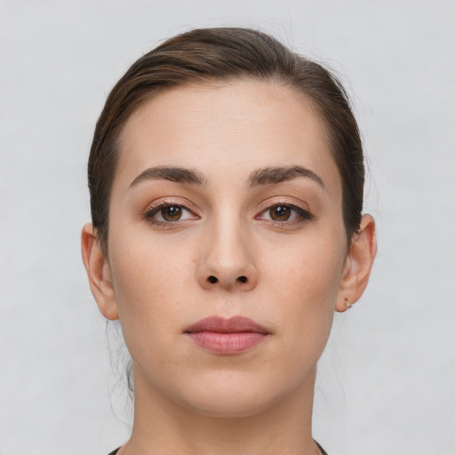 Neutral white young-adult female with short  brown hair and brown eyes