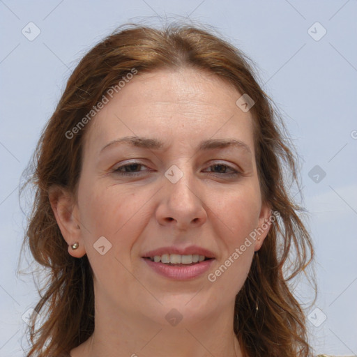 Joyful white adult female with long  brown hair and brown eyes