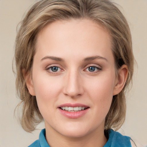 Joyful white young-adult female with medium  brown hair and blue eyes