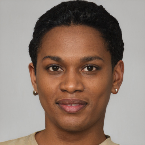 Joyful latino young-adult female with short  black hair and brown eyes