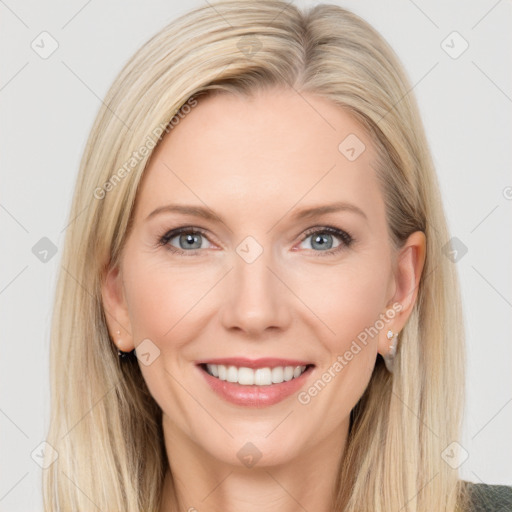 Joyful white adult female with long  brown hair and grey eyes