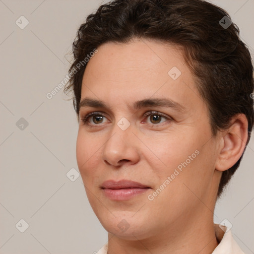 Joyful white adult female with short  brown hair and brown eyes